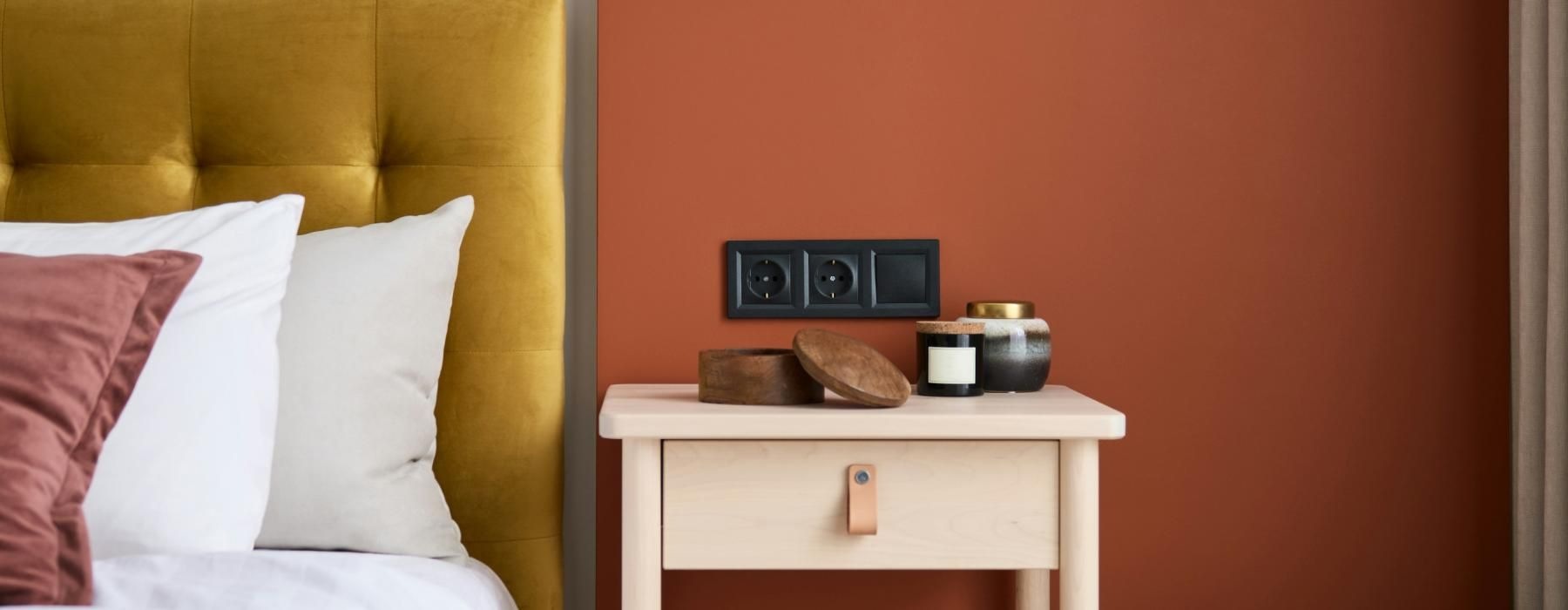 a bedroom with a bed and a sidetable