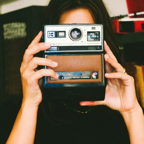 a person holding a camera