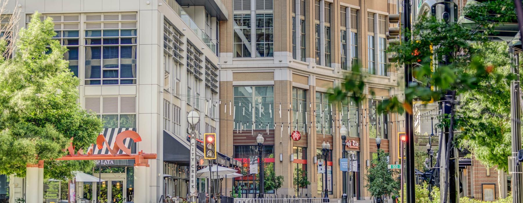 a street view of buildings with trees